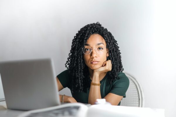 Woman using a laptop looking anxious